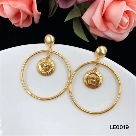 versace vintage gold earring clip on|Versace medusa hoop earrings.